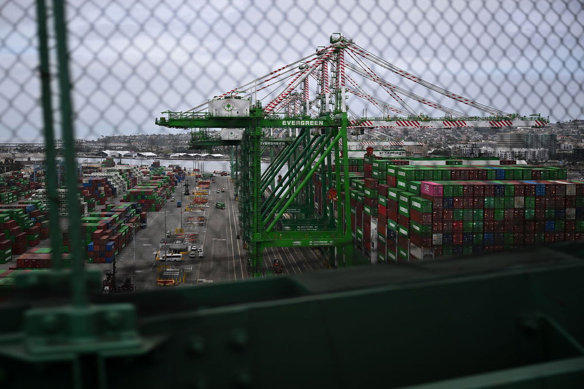 <i>Patrick T. Fallon/AFP/Getty Images via CNN Newsource</i><br/>Cranes unload cargo shipping containers at the Port of Los Angeles in San Pedro