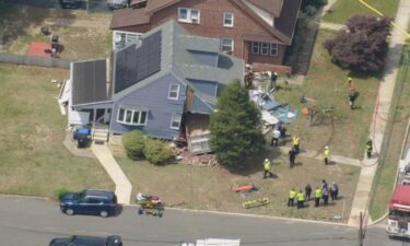 The driver of a dump truck was removed safely after slamming into a home in Gloucester County