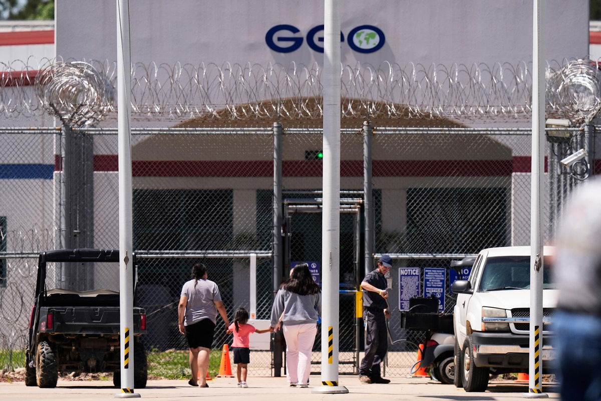 <i>Gerald Herbert/AP via CNN Newsource</i><br/>Visitors walk into the Central Louisiana ICE Processing Center in Jena