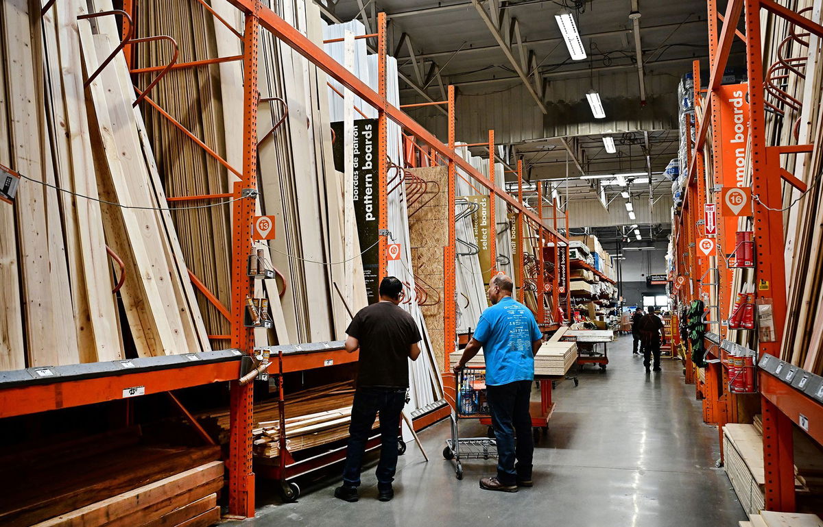 <i>Frederic J. Brown/AFP/Getty Images via CNN Newsource</i><br/>People shop for lumber from a Home Depot store in Alhambra