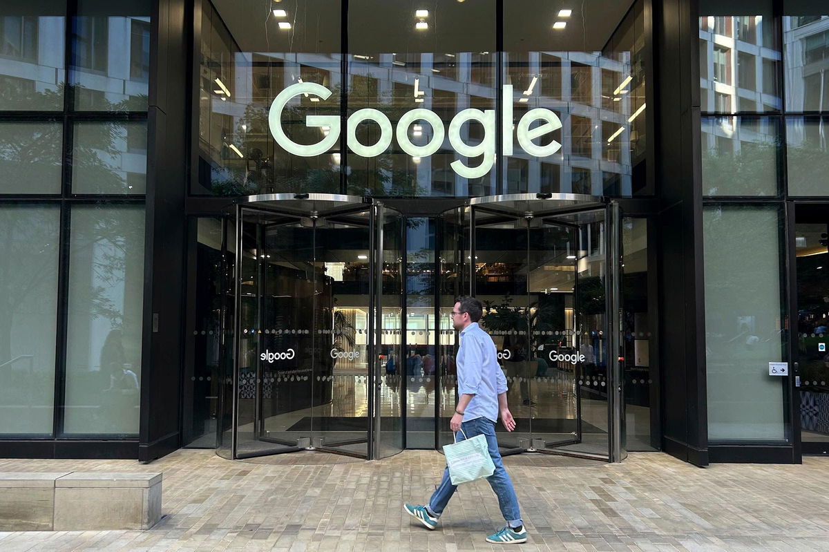 <i>Brian Melley/AP via CNN Newsource</i><br/>A man walks past Google's offices in London's Kings Cross area on August 2024.