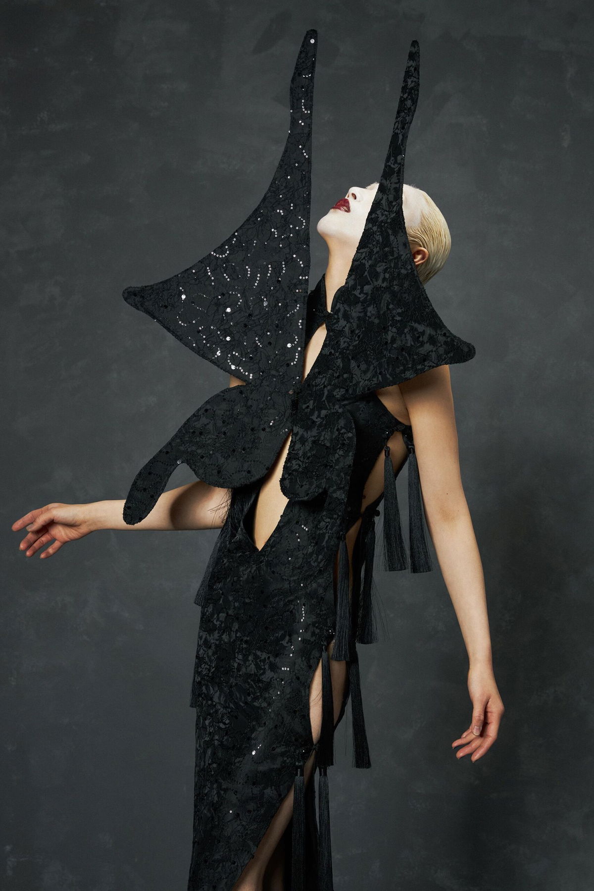 <i>Kuai Li via CNN Newsource</i><br/>The black fabric from Megan Thee Stallion’s dress was also used in a collection from the brand earlier this year. Here the qipao is reimagined to cinematic effect; the swallowtail butterfly serves as inspiration.