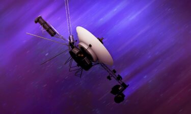 An artist's illustration shows one of the Voyager spacecraft flying through interstellar space at around 35