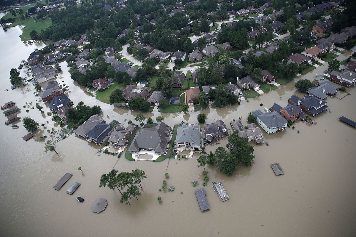<i>Win McNamee/Getty Images via CNN Newsource</i><br/>Flooded homes are shown near Lake Houston following Hurricane Harvey August 30
