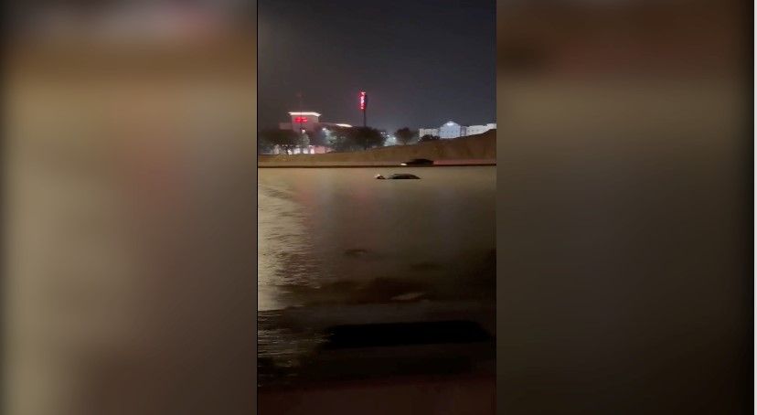 <i>@sanantonionursemidwife via CNN Newsource</i><br/>The roofs of some vehicles were seen peeking out of floodwaters on Interstate 35 just outside of San Antonio