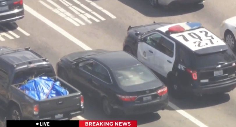 <i>KCAL/KCBS via CNN Newsource</i><br/>Los Angeles police are in pursuit of a reckless driver in the Mid-City area. SkyCal was overhead when the driver pulled up behind another LAPD patrol car at an intersection.
