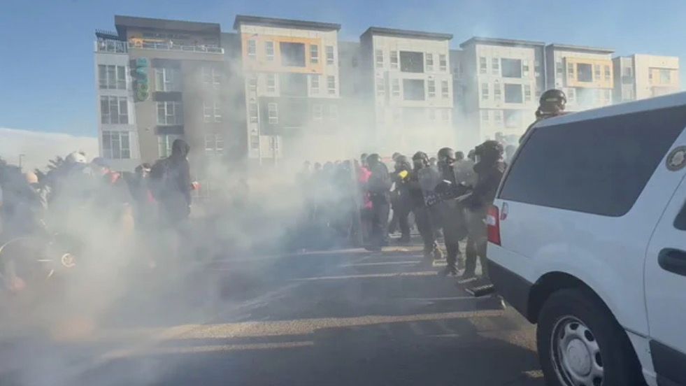 <i>KCNC via CNN Newsource</i><br/>Denver police officers deployed pepper balls and smoke at one group of protesters at the