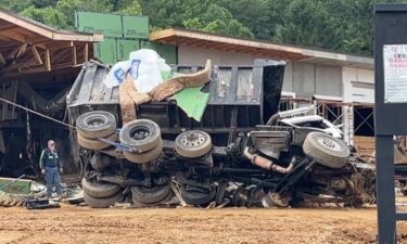 The scene of a fatal crash is pictured near Exit 73 along Interstate 40 in Old Fort. Police say the dump truck lost its brakes and exited the interstate before going airborne and crashing into the building.