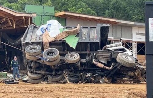 The scene of a fatal crash is pictured near Exit 73 along Interstate 40 in Old Fort. Police say the dump truck lost its brakes and exited the interstate before going airborne and crashing into the building.