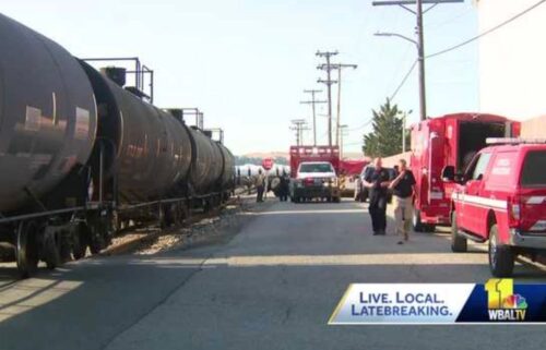 An investigation continues in South Baltimore after a tractor-trailer carrying aluminum sulfate collided with a train.