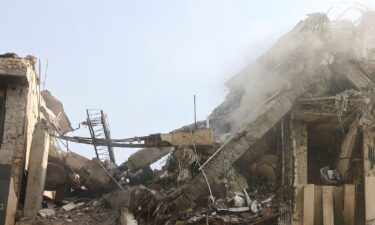 Smoke rises from a damaged building in the aftermath of Israeli strikes in Tehran on June 13