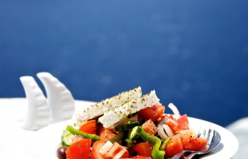 Greek salad is known as "village salad" in Greece. It includes tomatoes and a wedge of feta.