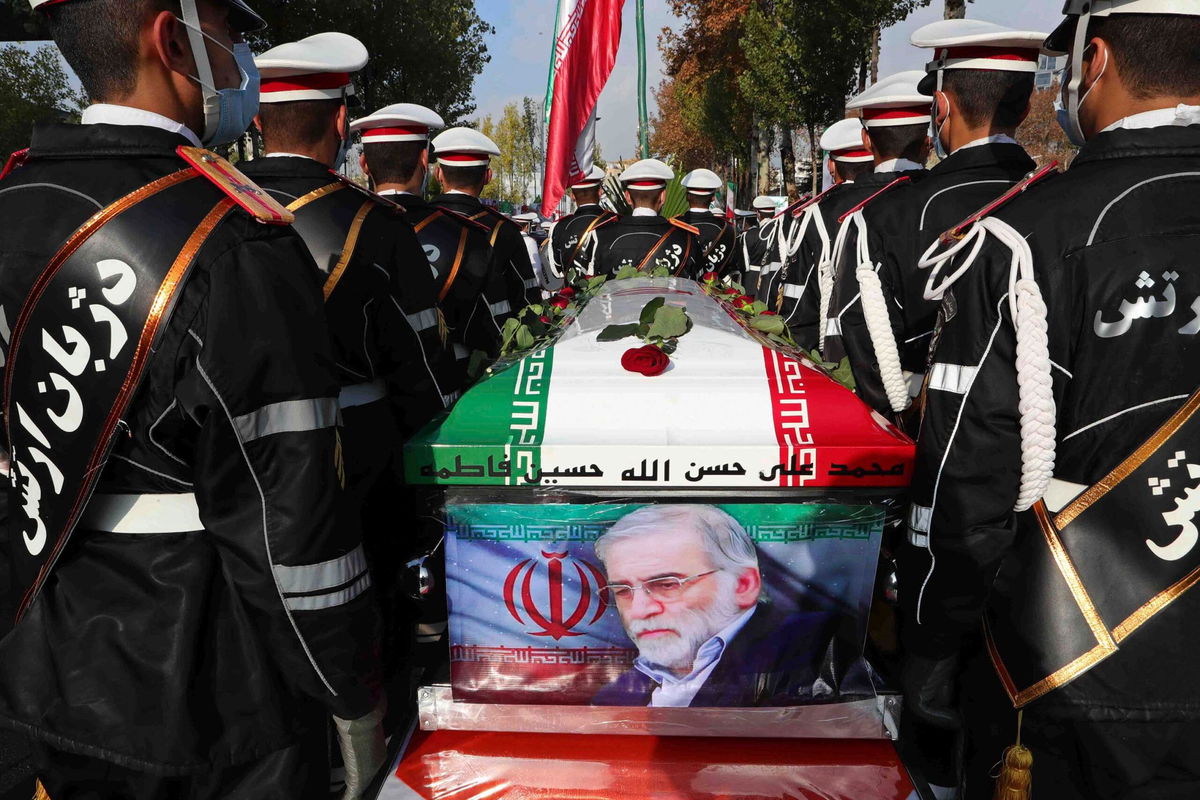 <i>Iranian Defense Ministry/AP via CNN Newsource</i><br/>Military personnel stand near the flag-draped coffin of Mohsen Fakhrizadeh during his funeral in Tehran