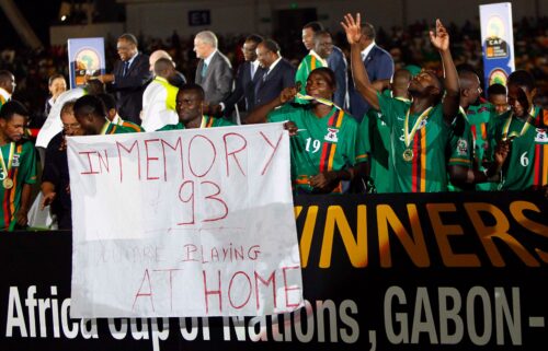 Zambia's players hold a banner in 2012 in memory of the 1993 plane crash that killed many members of the Zambian team.