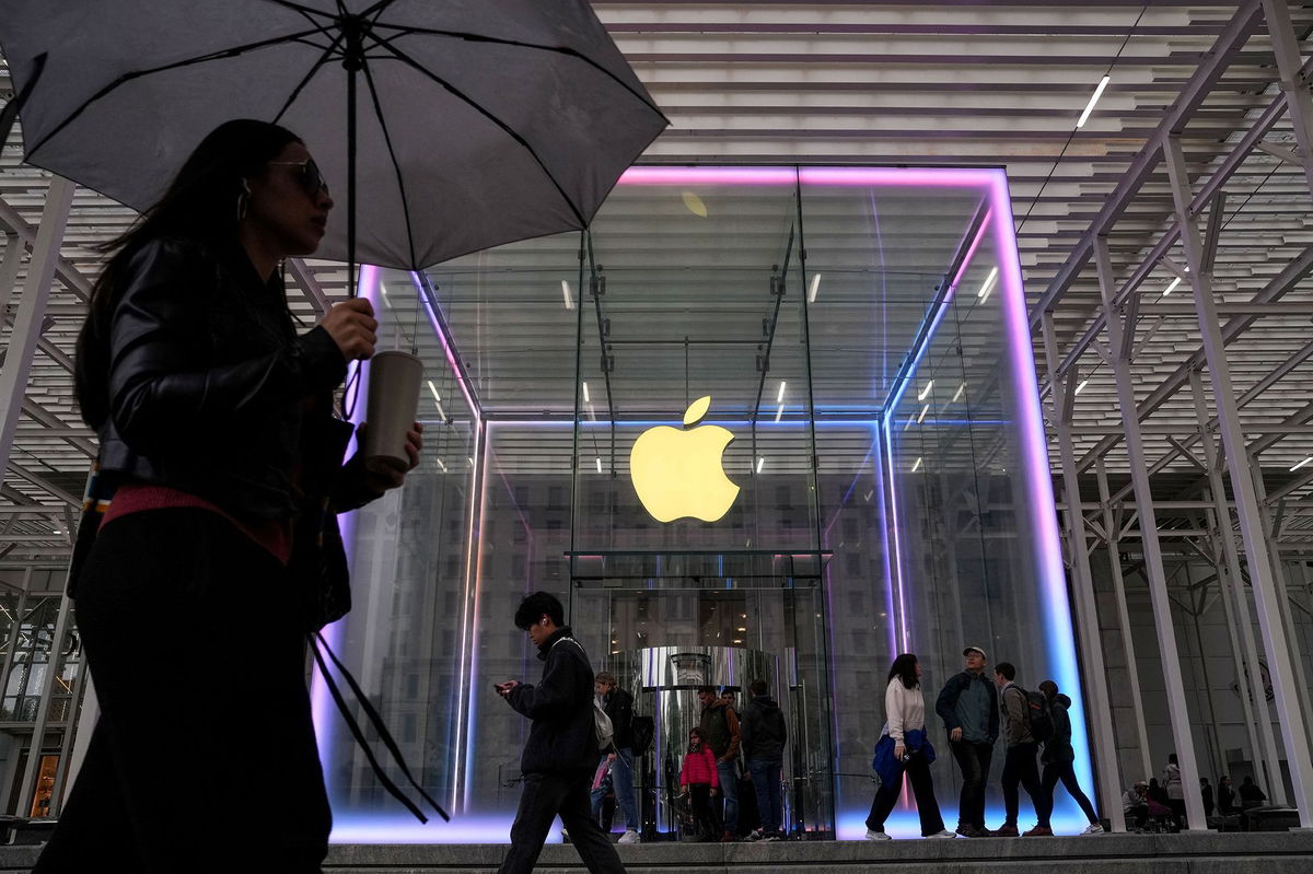 <i>Adam Gray/Reuters via CNN Newsource</i><br/>People walk past the Apple Fifth Avenue store in New York City.