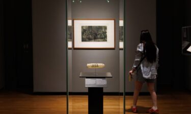 The condom is part of an exhibit on 19th-century prostitution and sexuality. The condom is decorated with an erotic etching featuring a nun and three clergymen