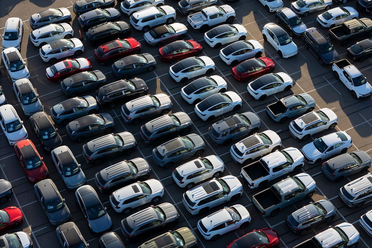 <i>Kevin Carter/Getty Images via CNN Newsource</i><br/>New vehicles are parked at the National City Marine Terminal in California