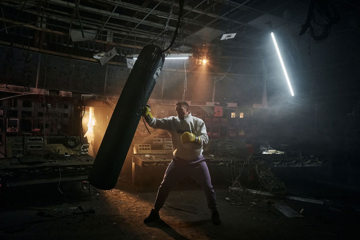 <i>Libkos/Getty Images via CNN Newsource</i><br/>Usyk hits a punch bag in a devastated energy plant in central Ukraine to hear stories of survival and resilience from frontline workers who are keeping the lights on for Ukraine on March 17.