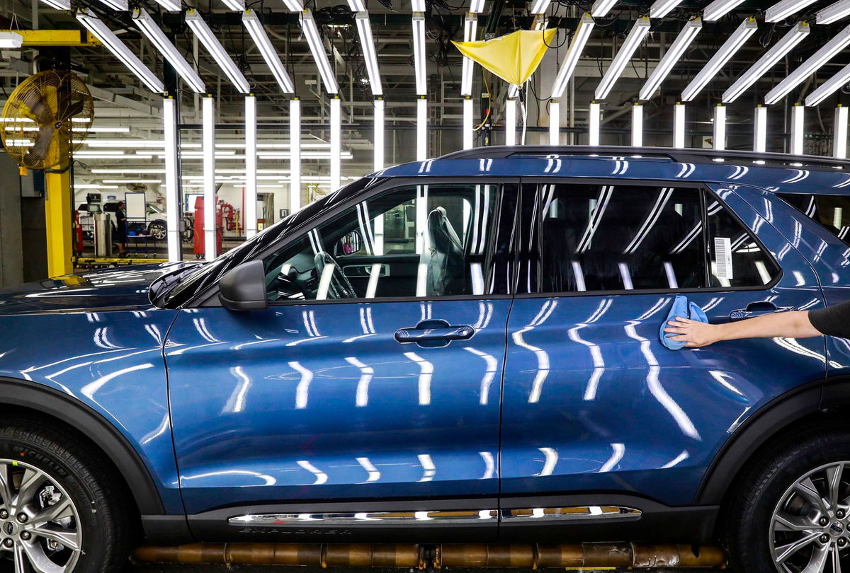 <i>Amr Alfiky/AP via CNN Newsource</i><br/>A Ford employee works on an Explorer line at the company's Chicago assembly plant in 2019. Ford reportedly shut the plant for a week due to the lack of rare earth magnets needs to build the car