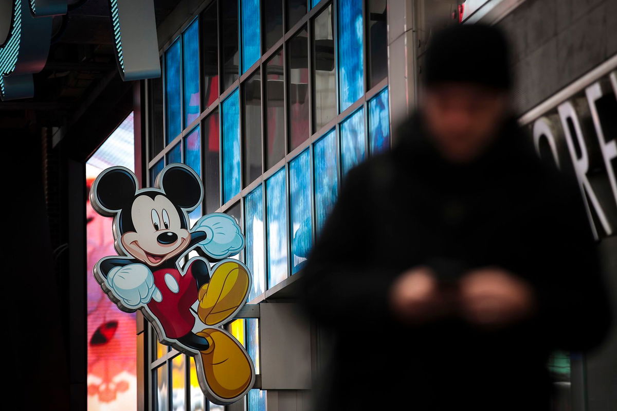 <i>Drew Angerer/Getty Images via CNN Newsource</i><br/>An image of Disney's Mickey Mouse displayed outside the Disney Store in Times Square in December 2017 in New York City. Disney and Universal are suing AI photo generator Midjourney for alleged copyright infringement.