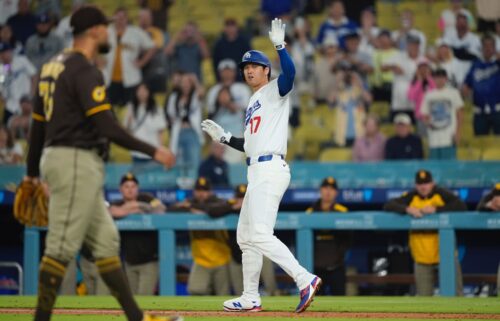 Dodgers superstar Shohei Ohtani waves off teammates after getting hit by a pitch in the ninth inning on June 19.