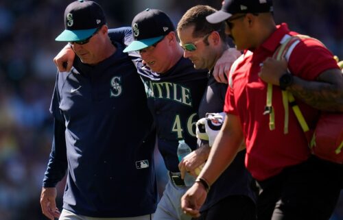 Seattle Mariners pitcher Trent Thornton had to be helped off the field during the eighth inning at Wrigley Field.