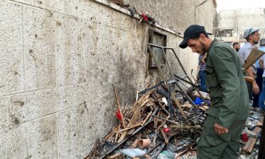 A member of the Syrian security force inspects the damage after a reported attack at the Mar Elias Church in the Dweila neighbourhood of Damascus