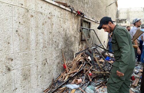 A member of the Syrian security force inspects the damage after a reported attack at the Mar Elias Church in the Dweila neighbourhood of Damascus