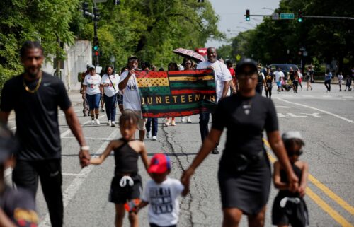 Residents of the historic Pullman neighborhood celebrate Juneteenth during a parade and block party hosted by the National A. Philip Randolph Pullman Porter Museum in Chicago on Thursday.