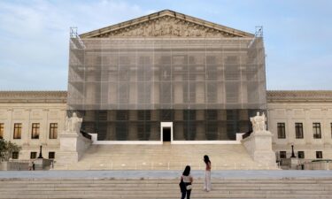 The Supreme Court on June 23 granted President Donald Trump’s emergency request to resume deporting migrants to countries other than their homeland. People take photos at the US Supreme Court at dusk on June 10 in Washington