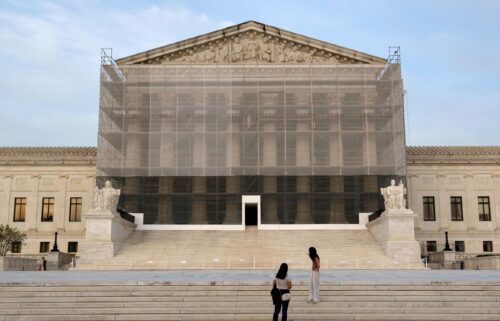 The Supreme Court on June 23 granted President Donald Trump’s emergency request to resume deporting migrants to countries other than their homeland. People take photos at the US Supreme Court at dusk on June 10 in Washington
