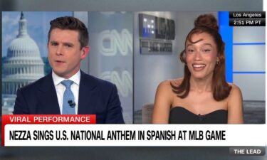 Nezza sings the national anthem in Spanish before a baseball game between the Los Angeles Dodgers and San Francisco Giants at Dodger Stadium on June 14 in Los Angeles.