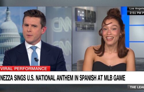 Nezza sings the national anthem in Spanish before a baseball game between the Los Angeles Dodgers and San Francisco Giants at Dodger Stadium on June 14 in Los Angeles.