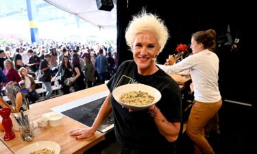 Anne Burrell makes a culinary presentation during the Food Network New York City Wine & Food Festival in October 2022 in New York City.  Burrell has died at the age of 55.