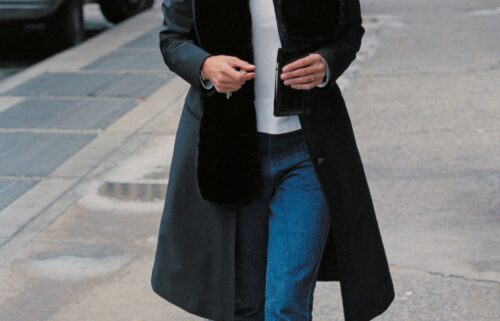 A tortoise shell headband and kick-flare jeans are among the key elements of Bessette-Kennedy's signature look.