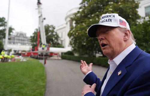 President Donald Trump speaks as a flagpole is installed on the South Lawn of the White House on June 18
