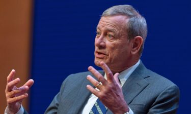 Chief Justice of the US Supreme Court John Roberts speaks during a lecture to the Georgetown Law School graduating class of 2025