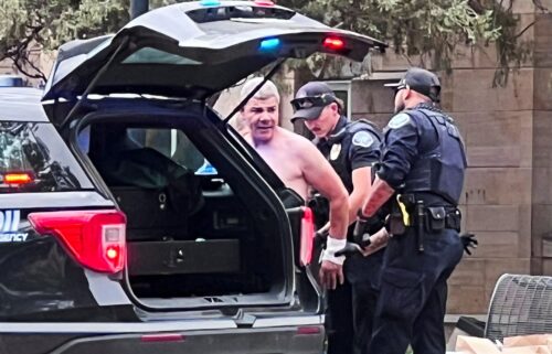 Law enforcement officers detain Soliman following the attack that injured multiple people on June 1.
