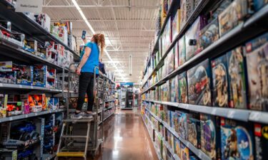 An employee counts inventory in a Walmart Supercenter on May 15 in Austin