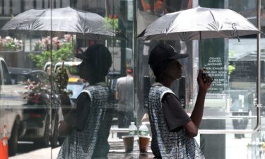 A person tries to stay cool in midtown Manhattan on Monday during extreme heat.