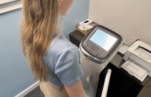 A mild electric current is sent through the body via the feet and thumbs on this bioelectrical impedance analysis machine.