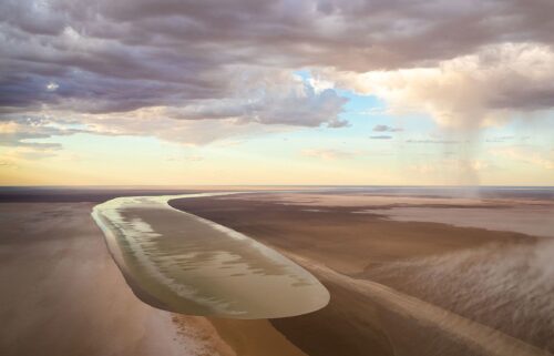 A photo of the Kalamurina Wildlife Sanctuary taken in 2018 shows floodwaters from north-west Queensland flowing into the area