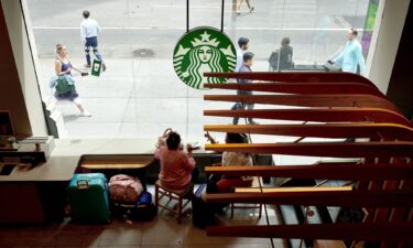 Customers at a Starbucks location in New York in August 2023. The company is trying to lure back customers looking to sit and enjoy a coffee drink.