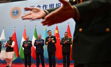 Defense ministers including China's Dong Jun (second from right) gather for a group photo during the SCO defense minister's meeting on Wednesday.