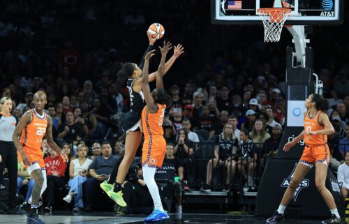 Wilson (left) had 22 points in the Aces' win over the Sun.