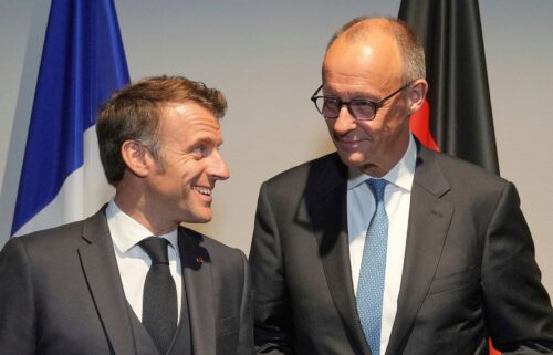 French President Emmanuel Macron speaks with Germany's Chancellor Friedrich Merz before a meeting on the sidelines of the NATO summit in The Hague