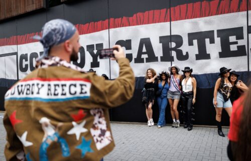 Concertgoers pose for a picture in London on June. 12.