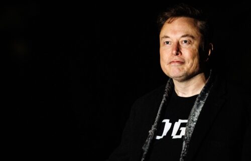 Elon Musk walks to the White House after landing in Marine One on the South Lawn with U.S. President Donald Trump (not pictured) on March 9