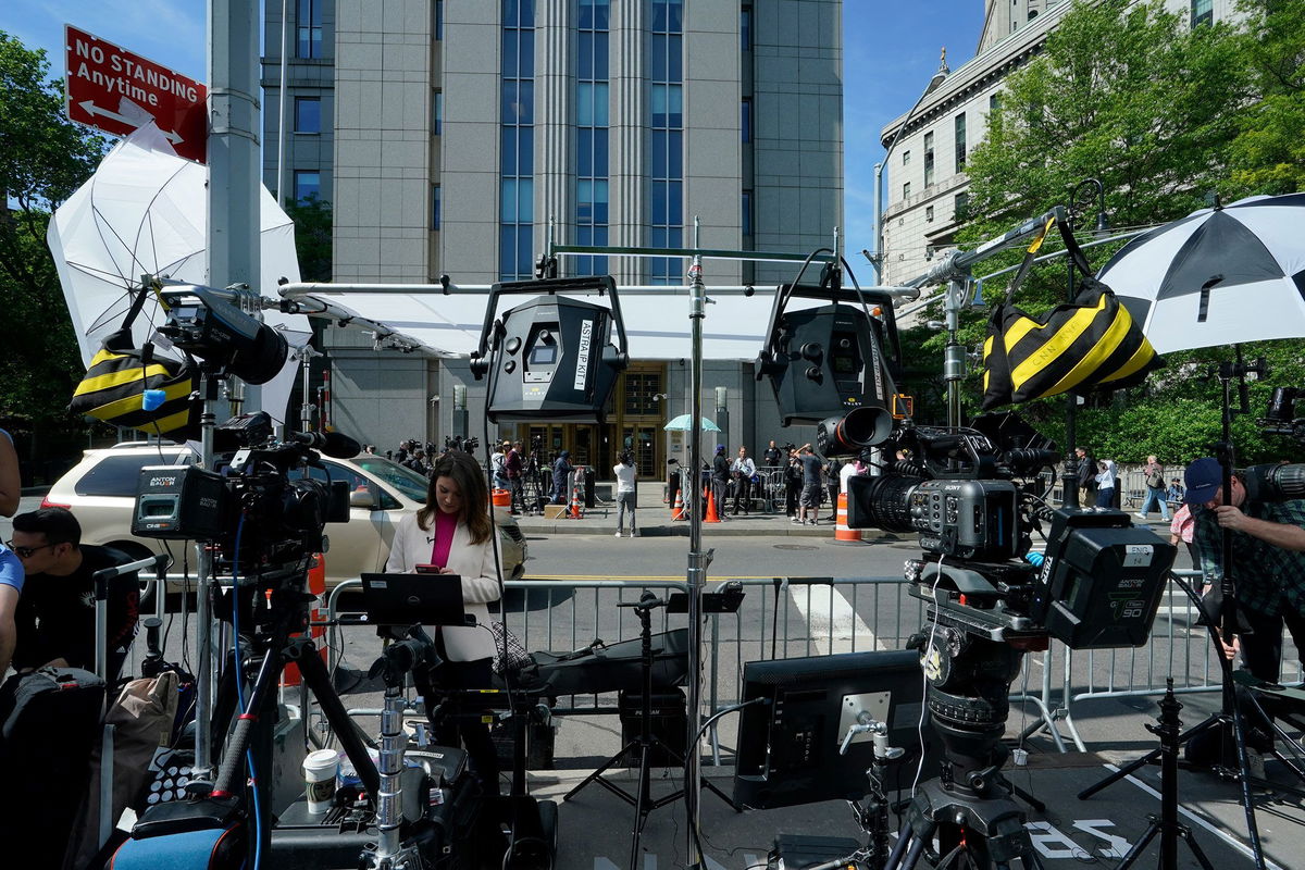 <i>Timothy A. Clary/AFP/Getty Images via CNN Newsource</i><br/>Media and television crews are set up outside federal court during the sex trafficking trial of Sean 