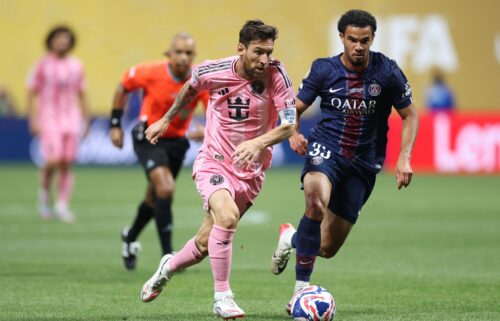 Inter Miami's Lionel Messi and Paris Saint-Germain's Warren Zaire-Emery fight for the ball during the FIFA Club World Cup 2025.